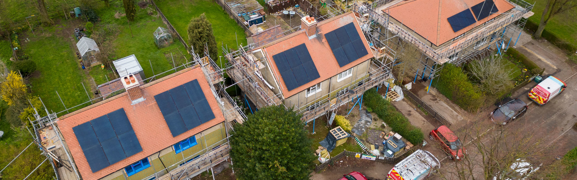 An aerial photograph of some new houses being built with solar panels on the roof. 