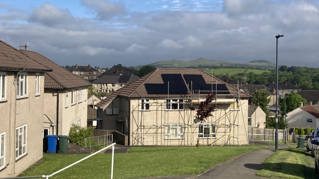 Solar panels on the roof of house house with scaffolding