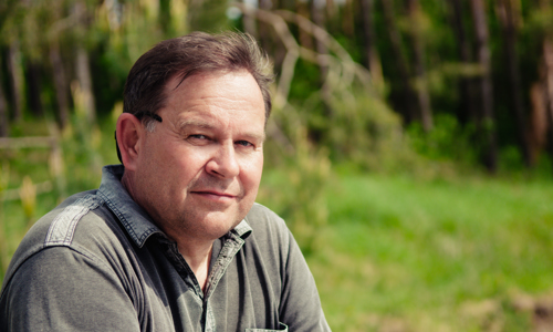 Close-up portrait of adult man outdoors