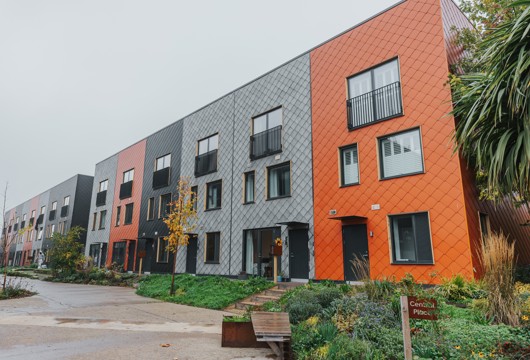 A row of multi-coloured terraced homes at the Climate Innovation District in Leeds.