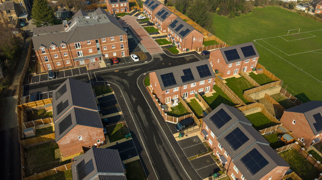 Aerial view of the St Andrews Grange development, showing new red‑brick houses with solar panels and surrounding streets.