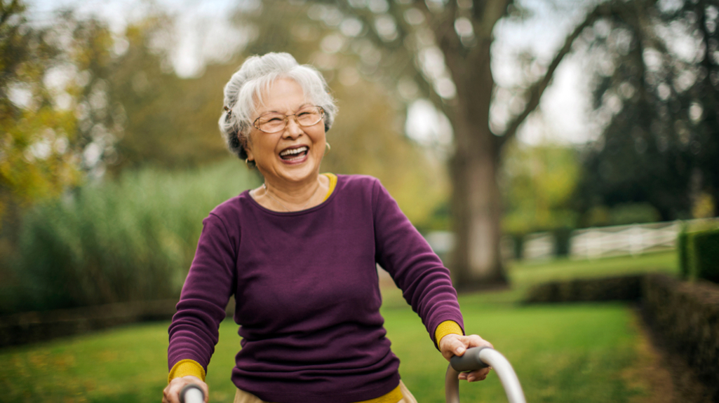 Smiling older woman with walking frame 