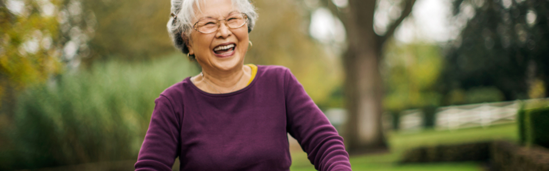 Smiling older woman with walking frame 