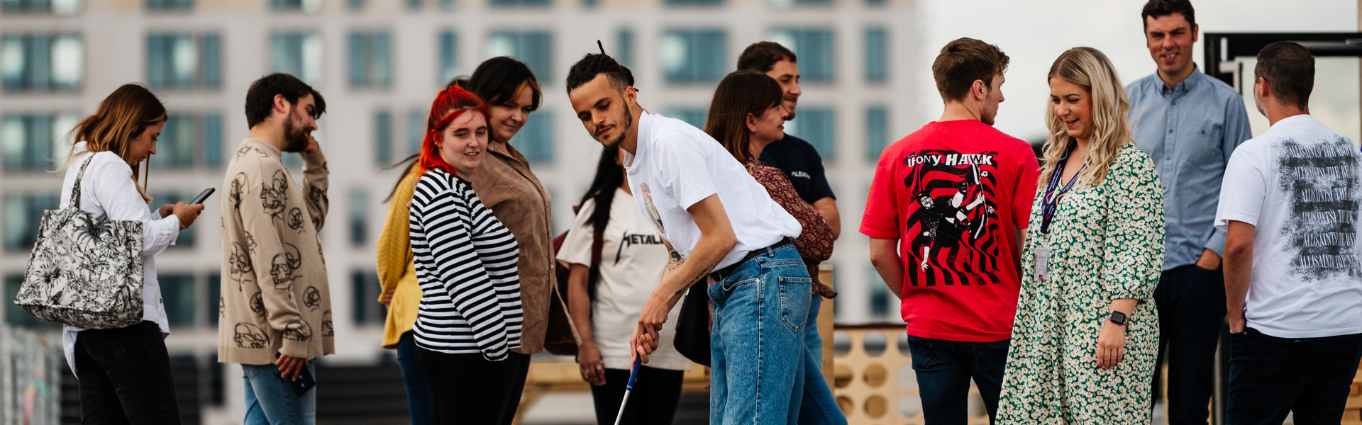 Colleagues playing mini golf on the roof.