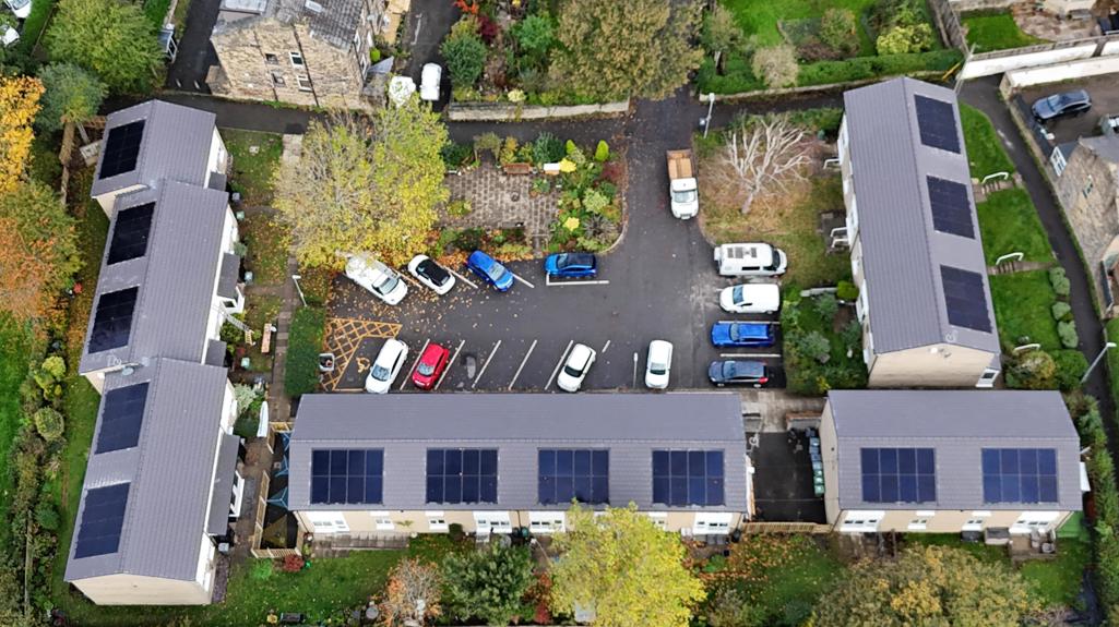 Aerial view showing completed roof works and solar panels across several Allen Croft buildings