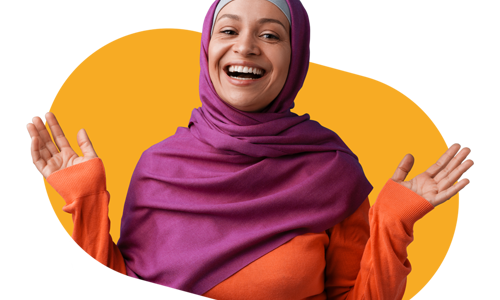 Woman wearing a hijab smiling with her hands in the air 