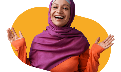 Woman wearing a hijab smiling with her hands in the air