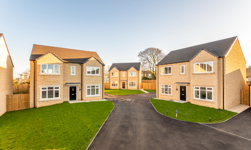 Three detached houses at the end of a cul-de-sac 