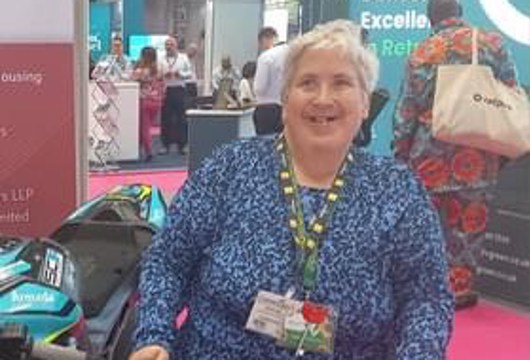 Disability Champion Mary Bottomley stood smiling at the camera 