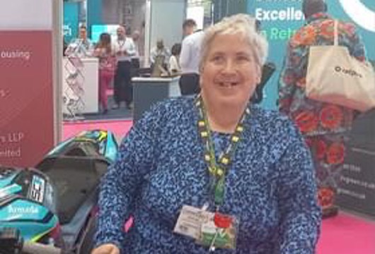 Disability Champion Mary Bottomley stood smiling at the camera
