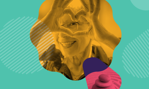 Picture of a woman making a heart sign with her hands on a green background