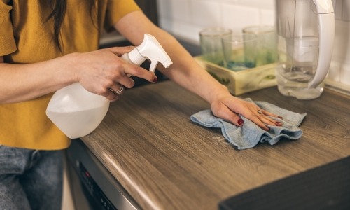 Cleaning a work surface in the kitchen