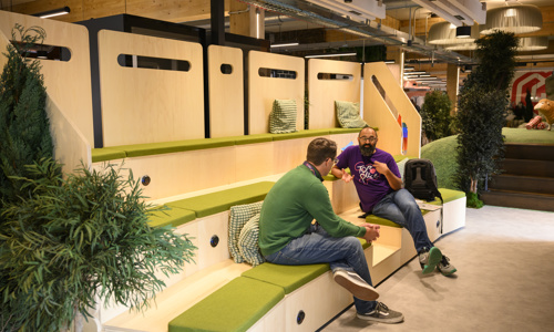 Colleagues talking in amphitheatre