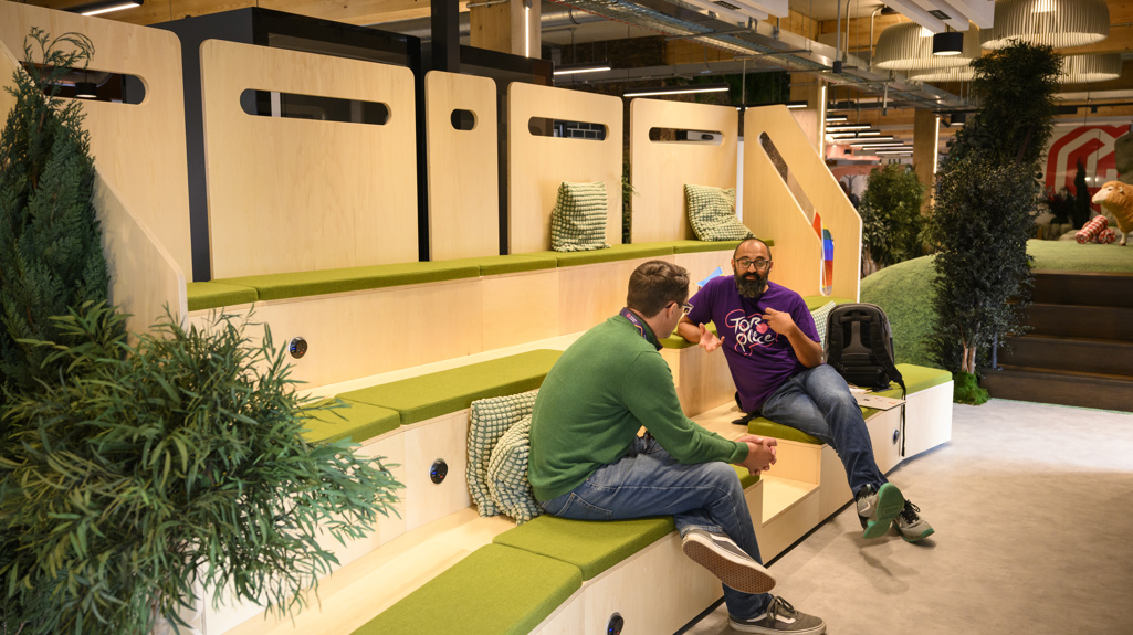 Colleagues talking in amphitheatre