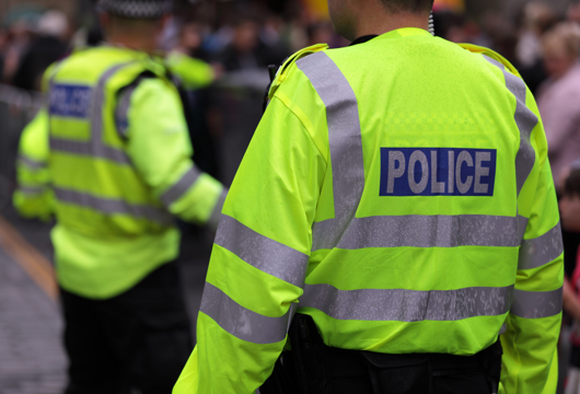 Two policemen in hi-vis coats