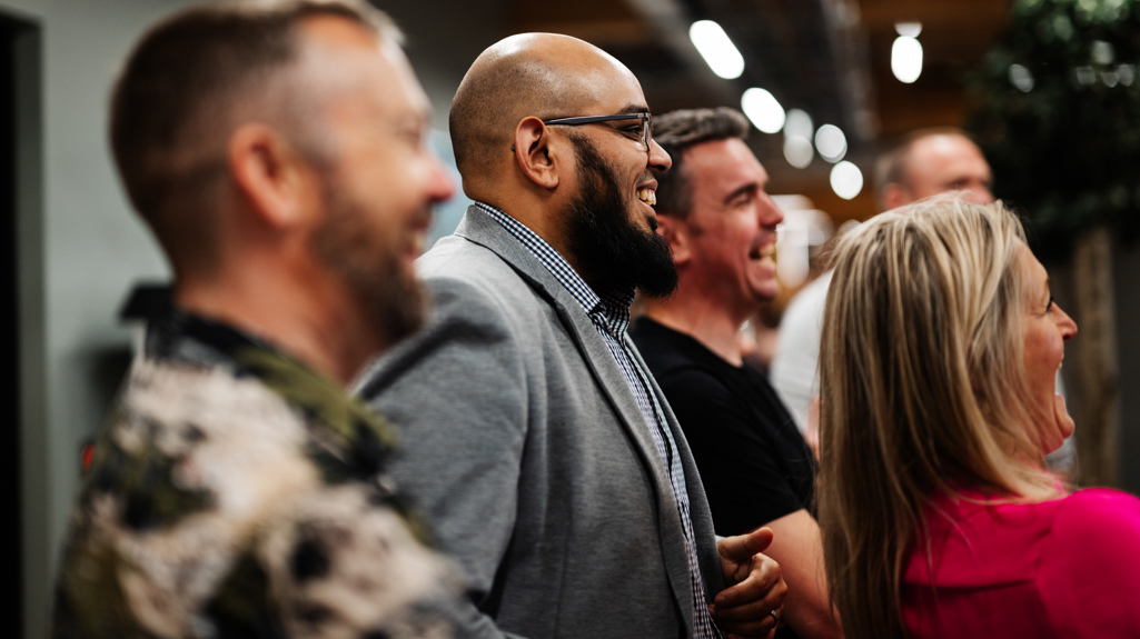 Colleagues laughing at The Place