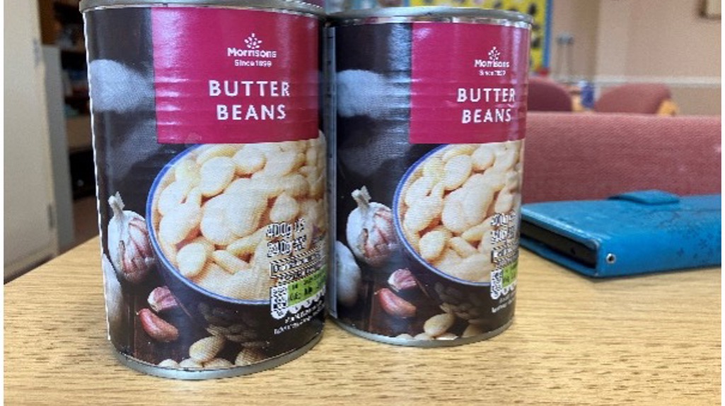 Two tins of butter beans on a table