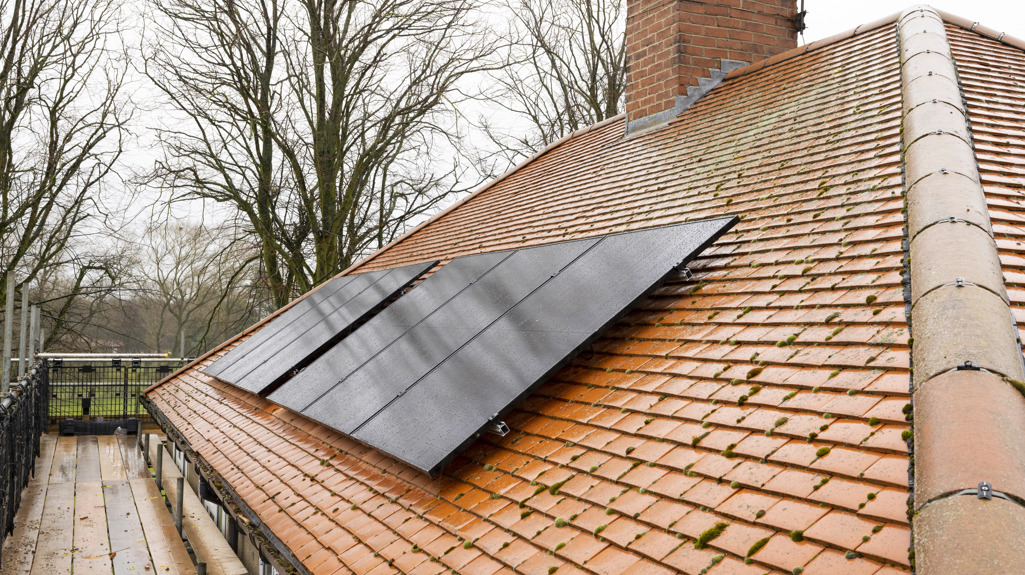 Six solar panels fitted on the roof of a house