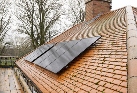 Six solar panels fitted on the roof of a house