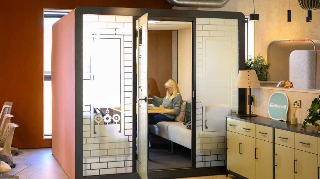 Meeting room with woman sitting 