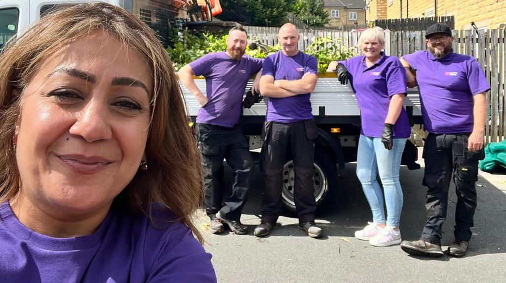 Housing officer Subhana with colleagues stood by a van