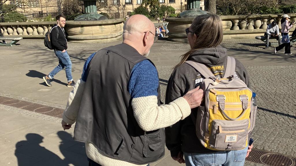 Two people walking in Sheffield city centre