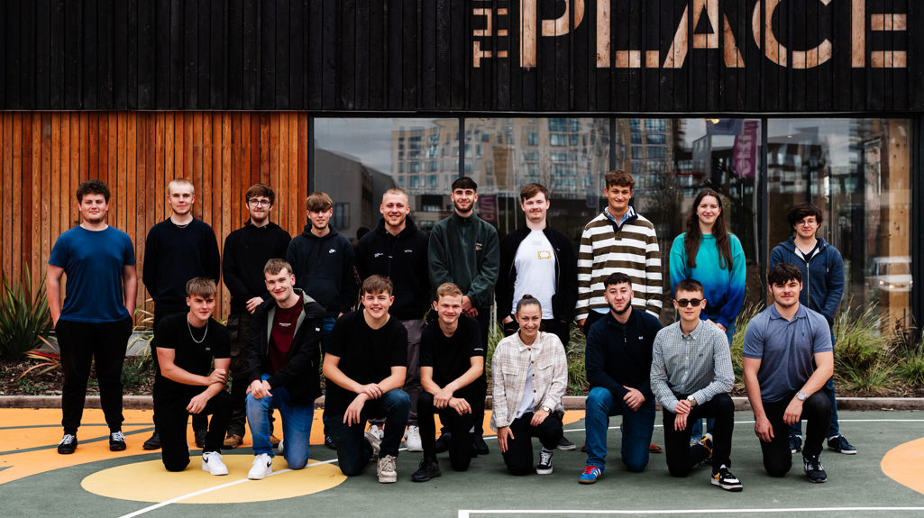 A group of colleagues, our apprentices, outside the place on their first day!