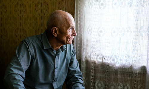 A man looking out the window