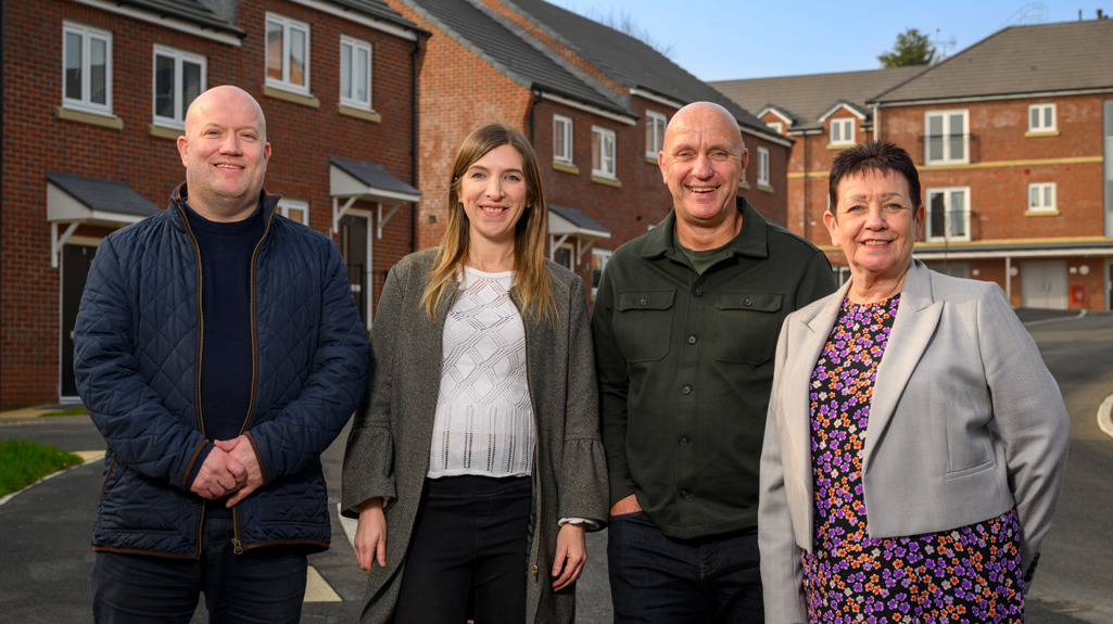 Four people standing together on a newly completed street at St Andrews Grange. From left to right: Jason McGarvey (Managing Director, Termrim Construction), Sian Webster (Executive Director of Growth and Assets, Yorkshire Housing), Nick Atkin (Chief Executive, Yorkshire Housing), and Councillor Mary Harland (Executive Member for Housing, Leeds City Council).