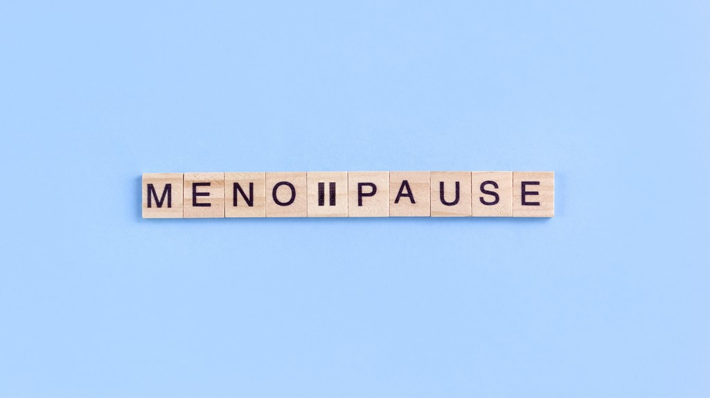 Scrabble wooden letters spelling the word menopause