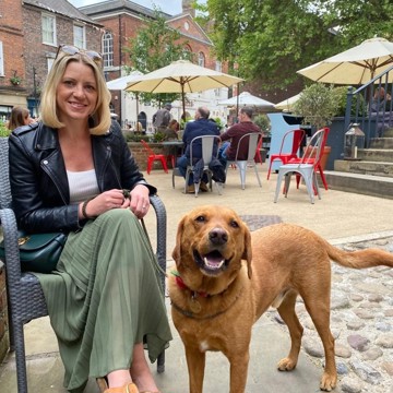Picture of Nina Evison and her lovely dog sat outside