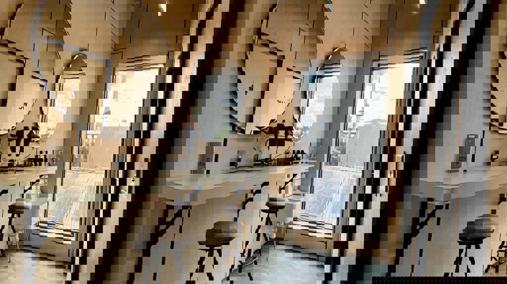 The Place - bathroom area with mirrors and hairdryers